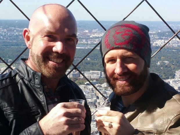 Chris, here with his fiance, kept his bald head covered with hats