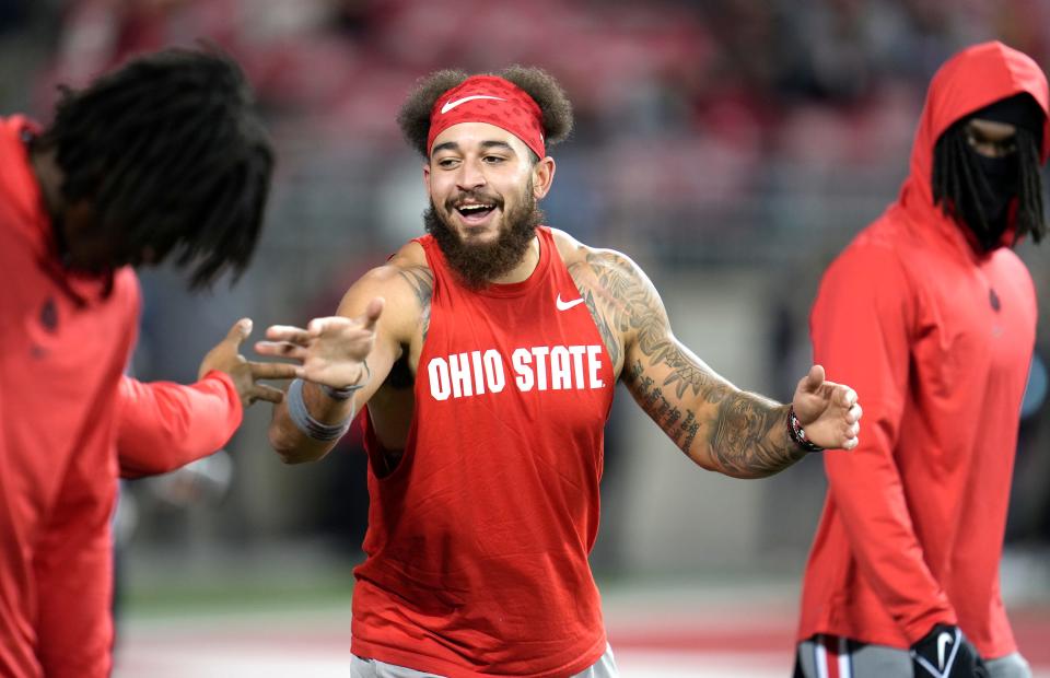 Nov 11, 2023; Columbus, Ohio, USA; Ohio State Buckeyes wide receiver Julian Fleming (4) jokes around with teammates during the NCAA football game against Michigan State University at Ohio Stadium.