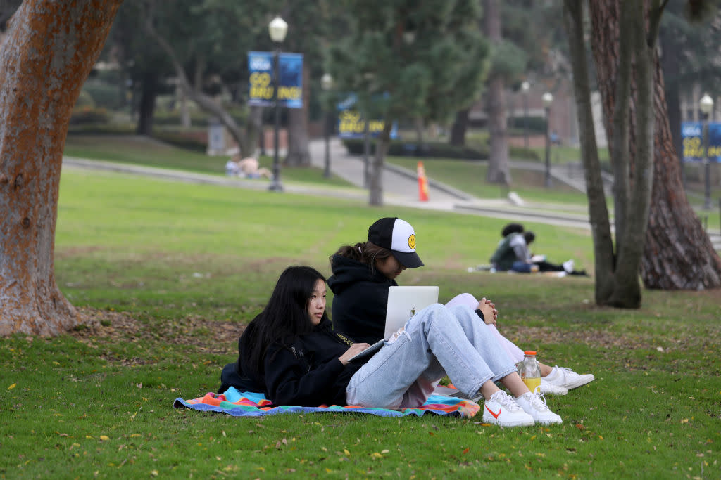 California Institute of Technology students Carolyn Lu, 19, left, and Teresa Huang, 19, on the campus of the University of California Los Angeles (UCLA) on Friday, Jan. 7, 2022 in Los Angeles, CA. University California officials announce extension of remote instruction on five campuses, say high COVID-19 positivity rates call for extra precautions. <span class="copyright">Gary Coronado-Los Angeles Times/Getty Images</span>