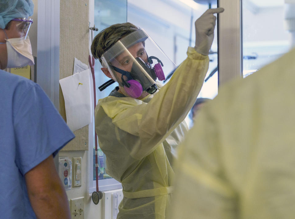 A medical personnel with full protective gear is shown at Salem Hospital in Salem, Oregon, on Friday, Aug. 20, 2021. COVID-19 cases are surging across Oregon, and many hospitals are filled to capacity. (Kristyna Wentz-Graff/Pool Photo via AP)