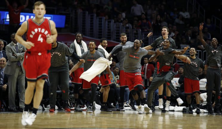 From the looks of it, the Raptors bench might agree with Jerry Stackhouse's assessment of Brady Heslip (4). (AP)