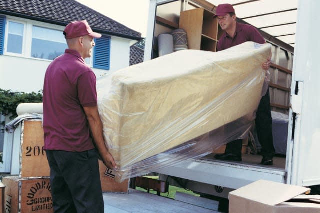 Movers Unloading Moving Van