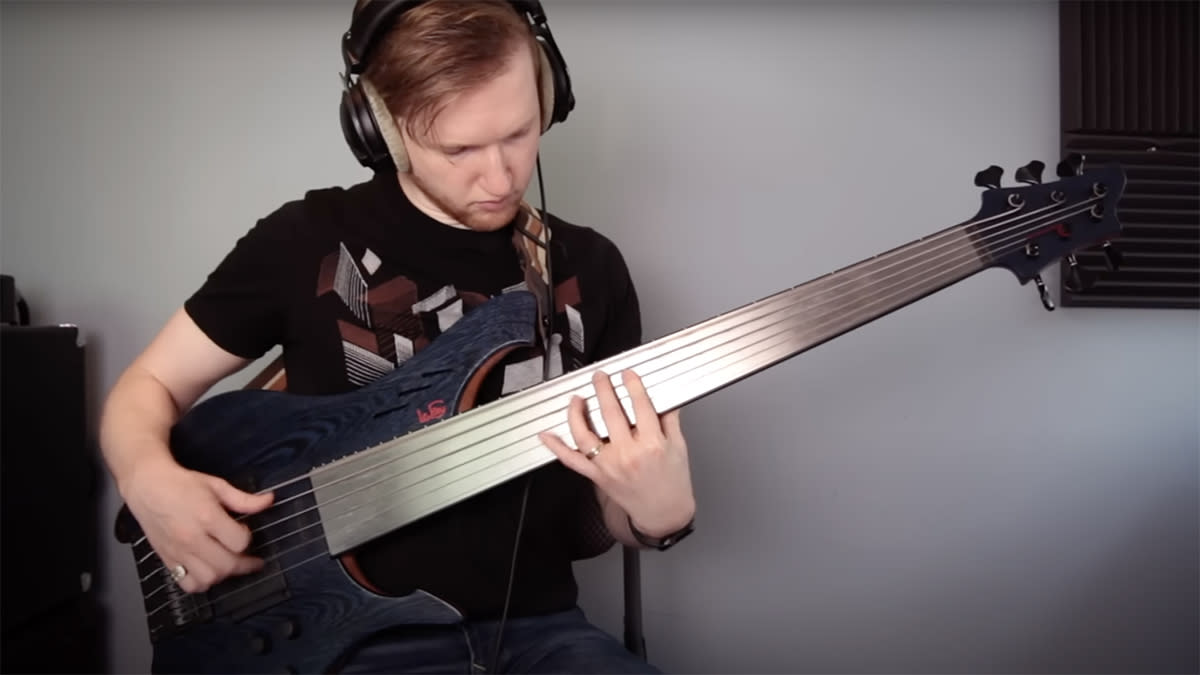  Charles Berthoud playing a fretless six-string bass guitar 