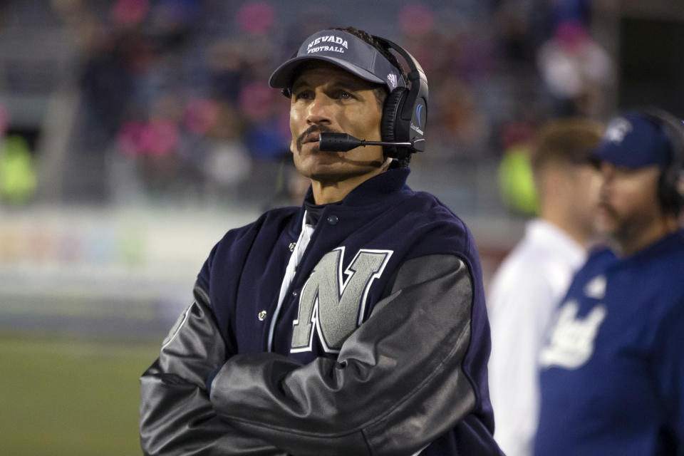 FILE -Nevada head coach Jay Norvell works the sidelines against New Mexico State in the second half of an NCAA college football game in Reno, Nev., Saturday, Oct. 9, 2021. Michigan is coming off its best season under Jim Harbaugh, finally breaking through to beat rival Ohio State and ending its longest drought without a Big Ten championship. The eighth-ranked Wolverines host Colorado State on Saturday, Sept. 3, 2022 at home in the opener for both teams. Former Nevada coach Jay Norvell will make his debut with the Rams.(AP Photo/Tom R. Smedes, File)