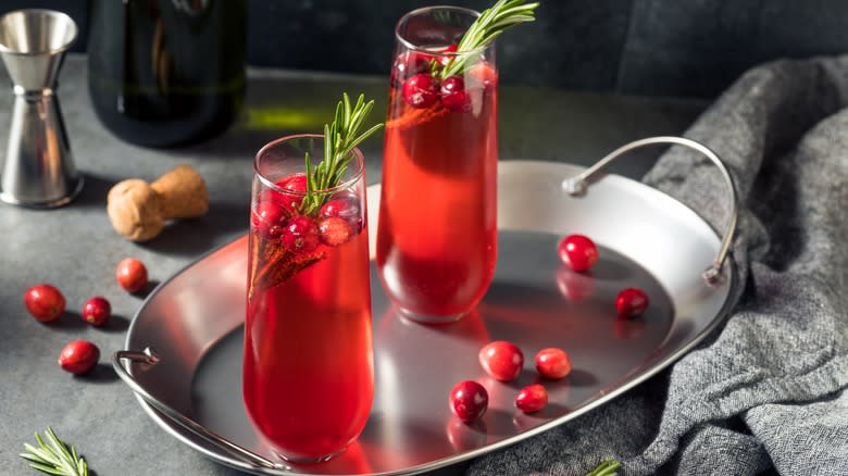 two poinsettia cocktails on tray