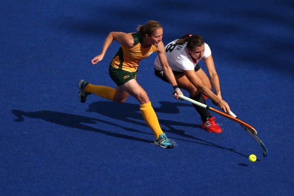 Kathleen Taylor of South Africa competes with Julia Mueller of Germany in the Women's Hockey preliminary match between South Africa and Germany on Day 6 of the London 2012 Olympic Games at Riverbank Arena on August 2, 2012 in London, England. (Photo by Daniel Berehulak/Getty Images)