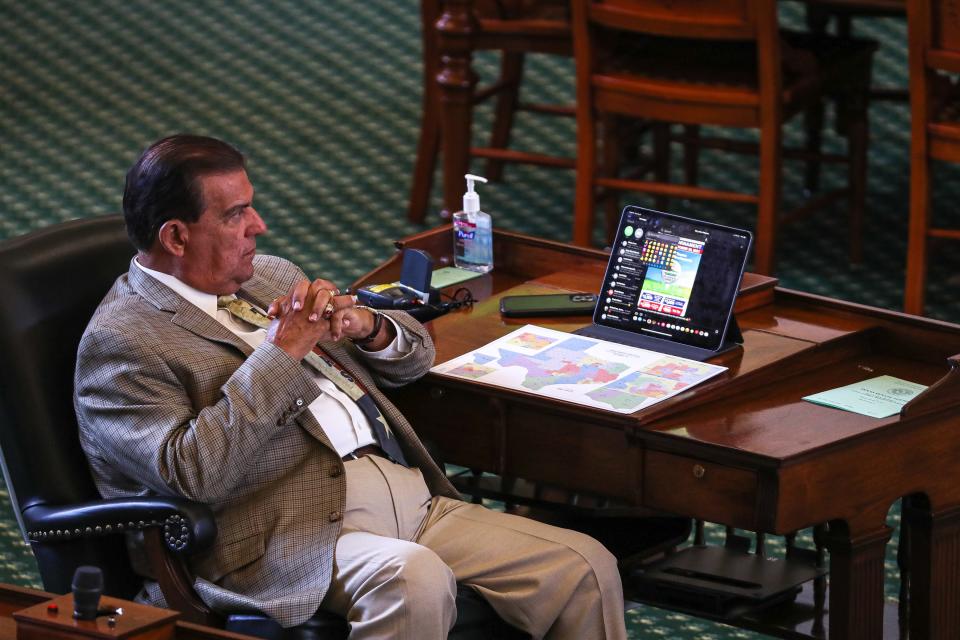 Texas Senator Eddie Lucio Jr. sits at his desk in the4 Senate chamber.. The Texas Senate met for the start of a new special session on Sept. 20, 2021.