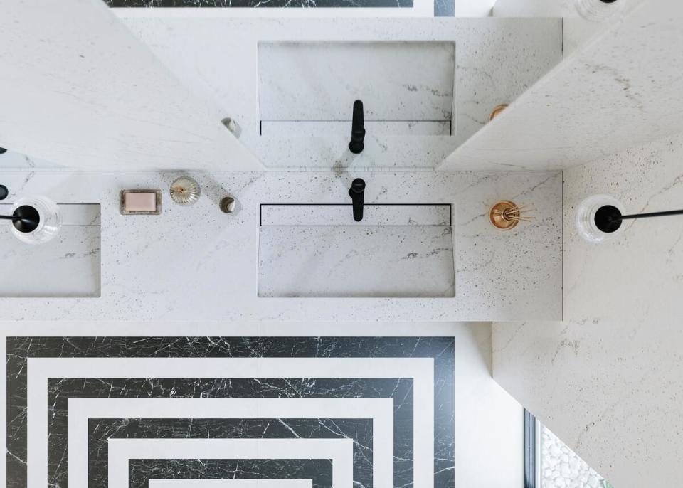 Eclectic Pearl countertops and walls bestow an elegant bathroom with a scattering of diamond-esque accents 