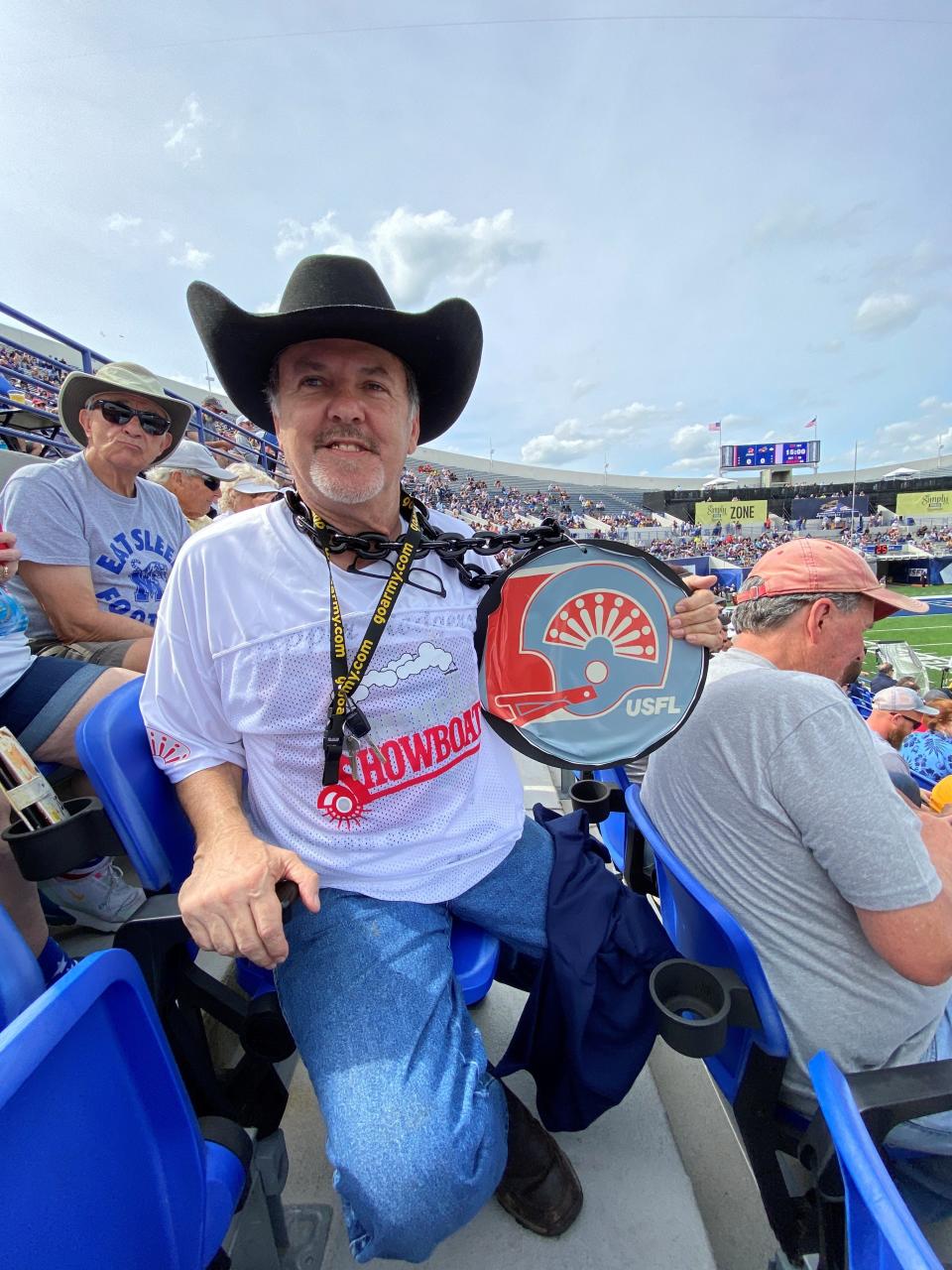 Memphis Showboats fan Ken Brasel shows off some memorabilia from the original Showboats franchise, which played in Memphis in the mid-1980s.
