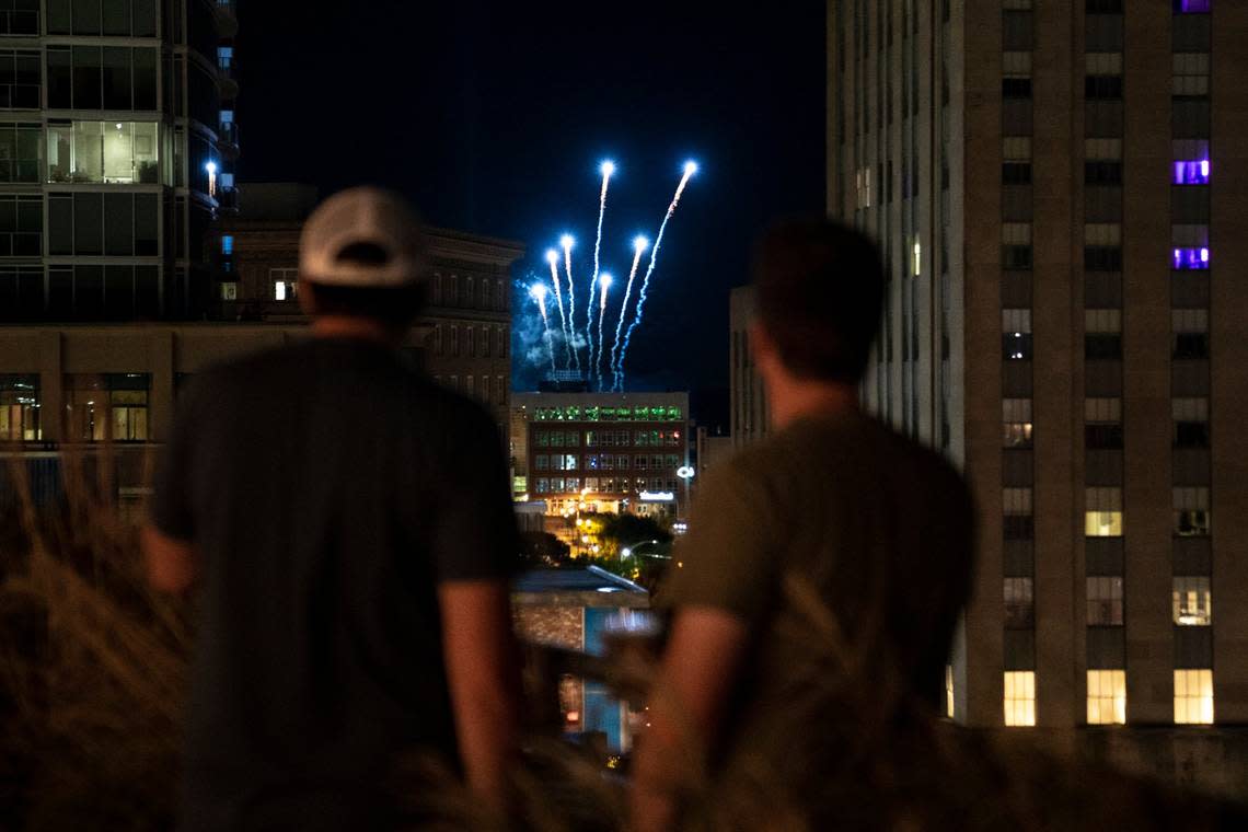 Fireworks for the Durham Bulls Game explode behind the roof of the Durham hotel in downtown on Saturday, June 18, 2022.