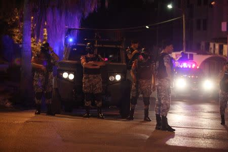 Policemen are seen near the Israeli embassy in Amman, Jordan July 23, 2017. REUTERS/ Stringer NO RESALES. NO ARCHIVES