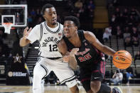 Temple's Jeremiah Williams (25) drives against Vanderbilt's Trey Thomas (12) during the first half of an NCAA college basketball game Tuesday, Dec. 7, 2021, in Nashville, Tenn. (AP Photo/Mark Humphrey)