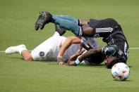 LA Galaxy defender Oniel Fisher, right, and Inter Miami midfielder Rodolfo Pizarro, left, collide during the first half of an MLS soccer match, Sunday, April 18, 2021, in Fort Lauderdale, Fla. (AP Photo/Lynne Sladky)