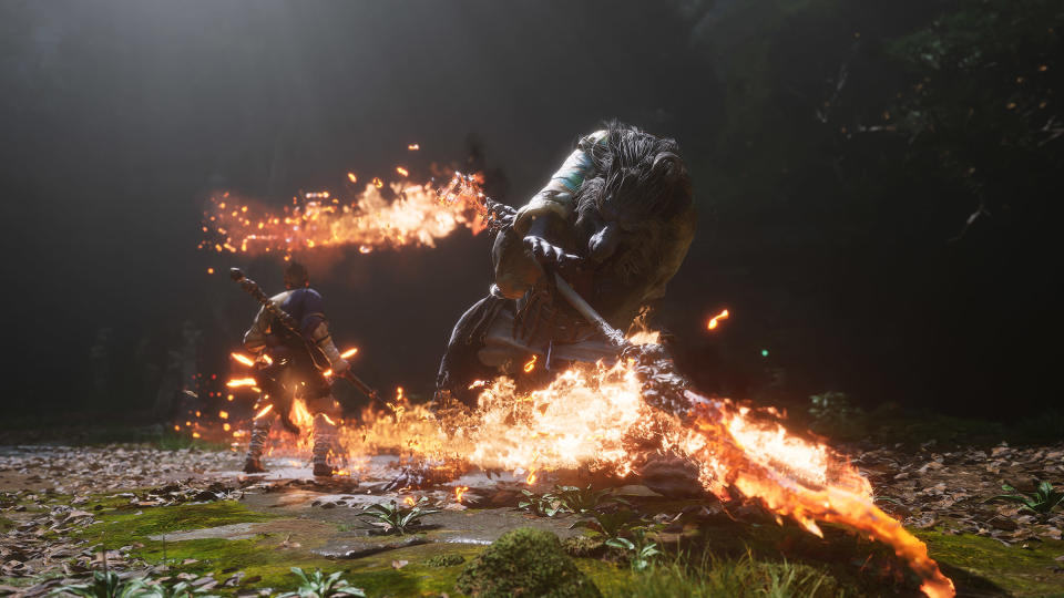 A screenshot from Black Myth: Wukong shows the hero fighting a flaming boss.