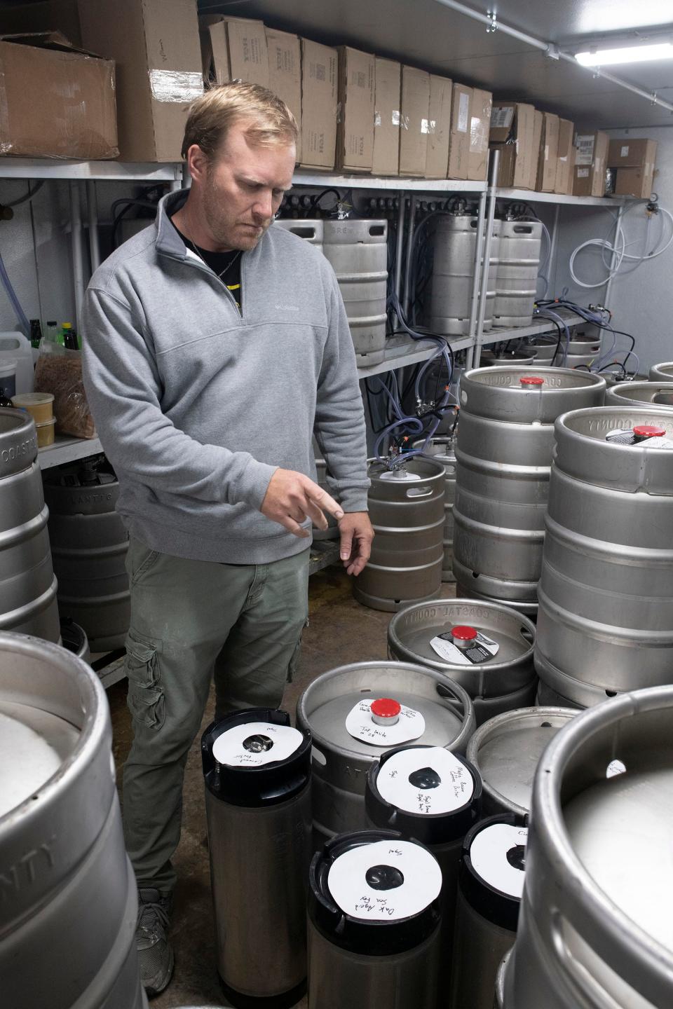 Brewmaster Fred Thibodeaux tends his stock of specialty beers created for this weekend's Weird Beer Fest at Coastal County Brewing on Wednesday, March 15, 2023. The third annual event will feature 78 one-of-a-kind beers on tap from various local breweries.