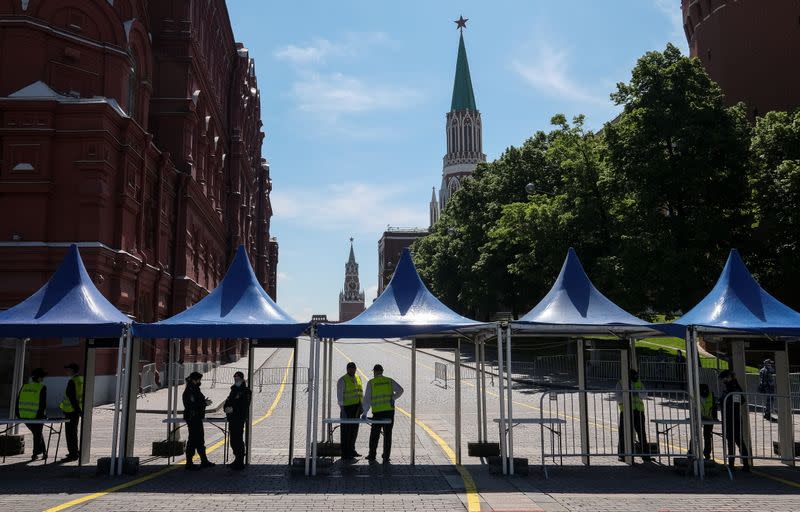 Security personnel get ready ahead of the annual Red Square Book Fair in central Moscow