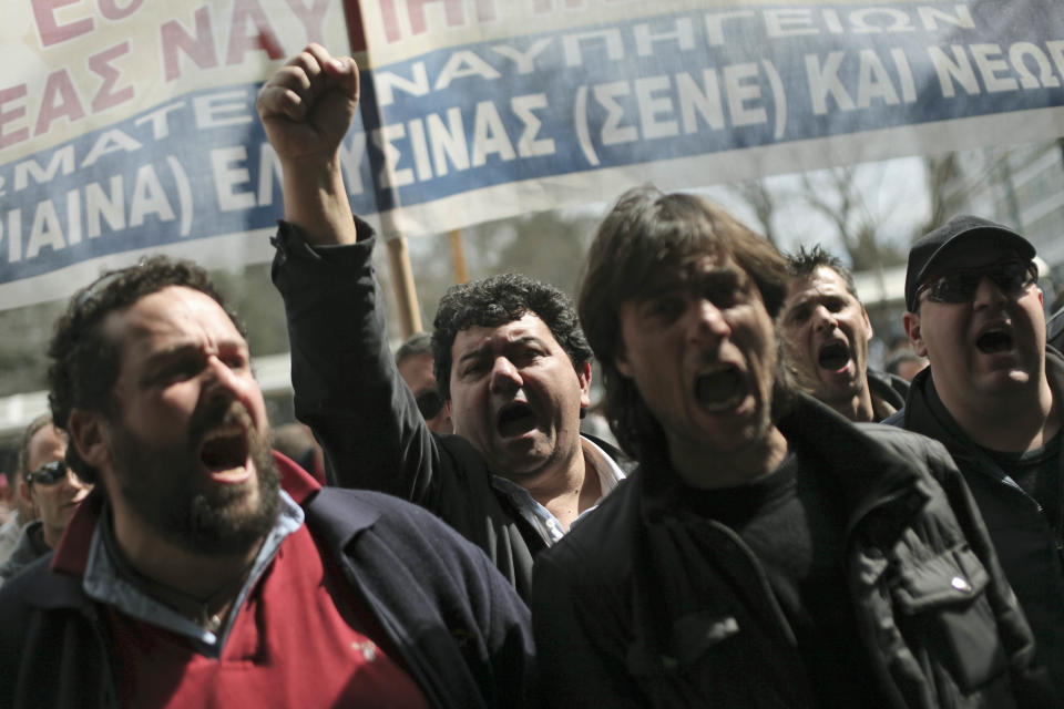Shipyard workers chant slogans outside the Greek Ministry of Finance during a protest to demand their unpaid wages in central Athens, on Thursday, March 15, 2012. Countries in the 17-nation eurozone on Wednesday formally approved a second bailout for Greece and authorized the release of euro39.4 billion ($51.44 billion), as they had signaled last week. (AP Photo/Petros Giannakouris)
