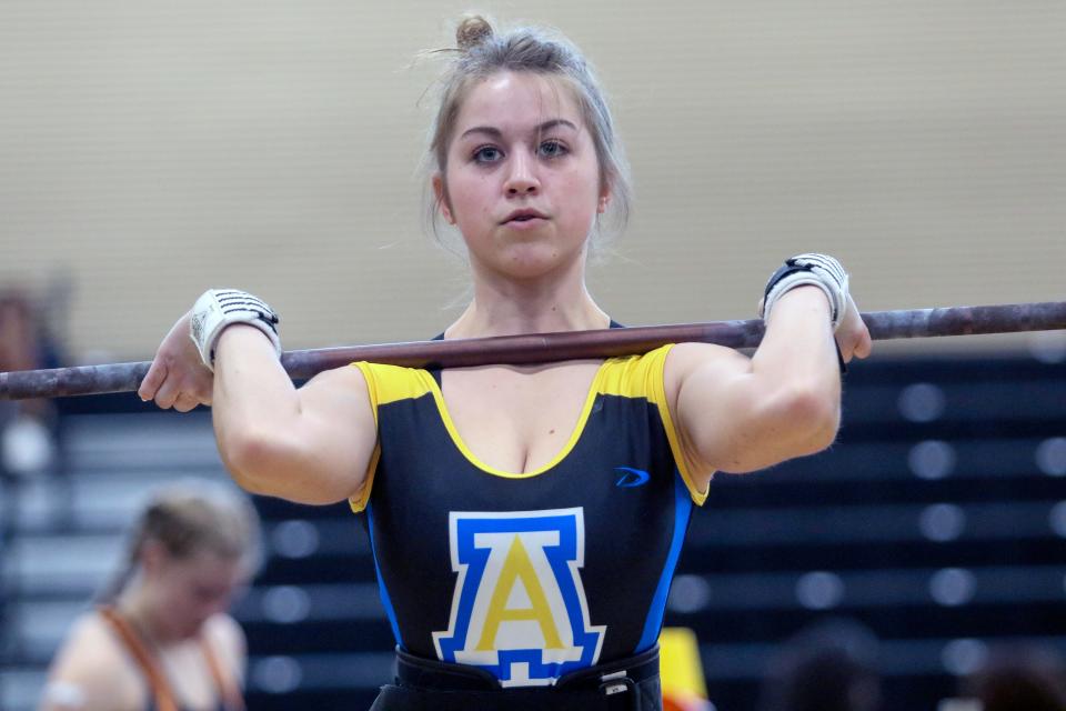 Auburndale senior Kathryn Pruitt prepares to complete a lift in the 110-pound weight class at the Class 2A, District 11 girls weightlifting meet at Davenport High School.