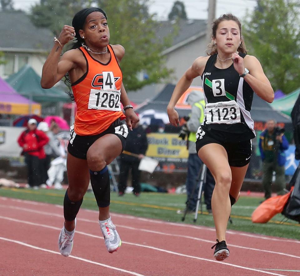 Central Kitsap's Kymeal Gaulden, left, competes in the 100 meter dash during the State Track and Field Championships at Mount Tahoma High School on Saturday, May 28, 2022. Gaulden took 3rd place.