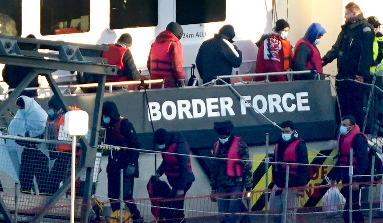 A group of people thought to be migrants are brought into Dover on 7 February. (Getty)