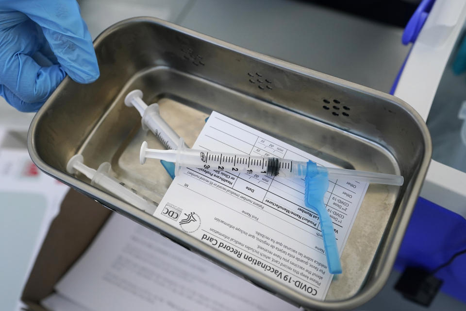 FILE - This May 13, 2021, file photo shows syringes filled with the Johnson & Johnson vaccine at a mobile vaccination site in Miami. Starting Thursday, Oct. 14, 2021, the Food and Drug Administration convenes its independent advisers for the first stage in the process of deciding whether extra shots of Moderna or Johnson & Johnson vaccines should be dispensed and, if so, who should get them and when. (AP Photo/Wilfredo Lee, File)