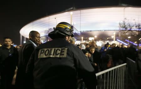 Police control crowds leaving the Stade de France where explosions were reported to have detonated outside the stadium during the France vs German friendly match near Paris, November 13, 2015. REUTERS/Gonazlo Fuentes