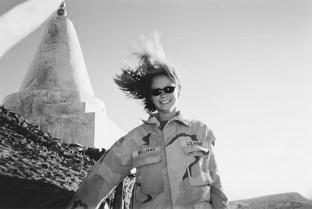 PHOTO: Kayla Williams in front of a Yezidi shrine on windy day on Sinjar Mountain, Iraq, in 2003. (Courtesy Kayla Williams)