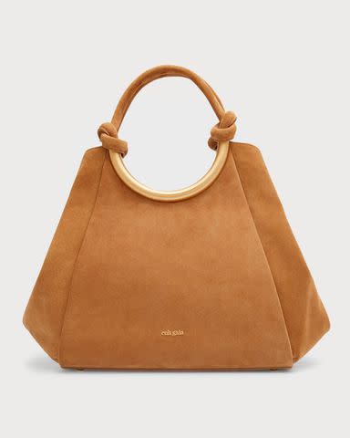 <p><a href="https://www.neimanmarcus.com/p/cult-gaia-nila-knot-suede-tote-bag-prod254660052" data-component="link" data-source="inlineLink" data-type="externalLink" data-ordinal="1" rel="nofollow">Cult Gaia</a></p>