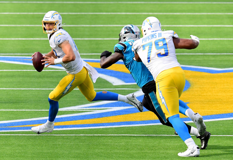 INGLEWOOD, CALIFORNIA - SEPTEMBER 27: Justin Herbert #10 of the Los Angeles Chargers rolls out.