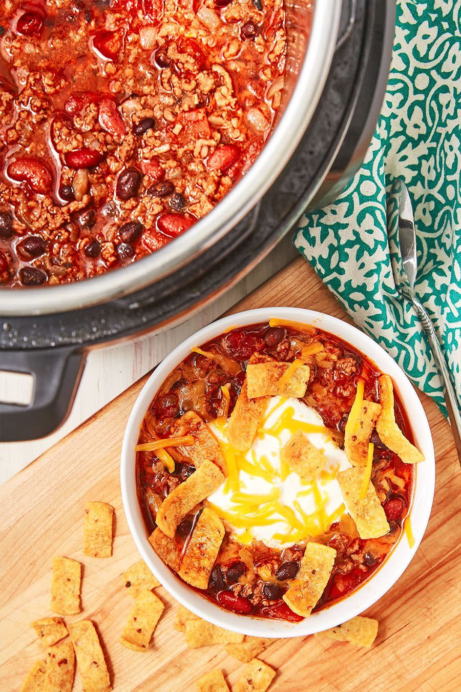 <p>If there's one thing the Instant Pot does well, it's chilli. The pot takes away all of the legwork of standing and stirring over the stove for forever. This is now our favourite <a href="https://www.delish.com/uk/cooking/recipes/a28886316/best-homemade-chilli-recipe/" rel="nofollow noopener" target="_blank" data-ylk="slk:Chilli Recipe;elm:context_link;itc:0;sec:content-canvas" class="link ">Chilli Recipe</a>. It's so flavourful! Swap in different beans or use minced turkey instead. It will all come out delicious! </p><p>Get the <a href="https://www.delish.com/uk/cooking/recipes/a30208142/instant-pot-chili-recipe/" rel="nofollow noopener" target="_blank" data-ylk="slk:Instant Pot Chilli;elm:context_link;itc:0;sec:content-canvas" class="link ">Instant Pot Chilli</a> recipe.</p>