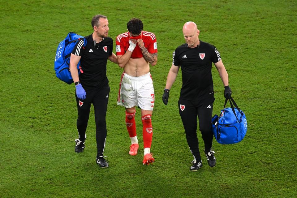 Neco Williams walks off the pitch as he is substituted after a head injury (Getty)