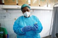 FILE PHOTO: A nurse prepares a dose of the AstraZeneca coronavirus disease (COVID-19) vaccine at the Ngaliema Clinic in Kinshasa