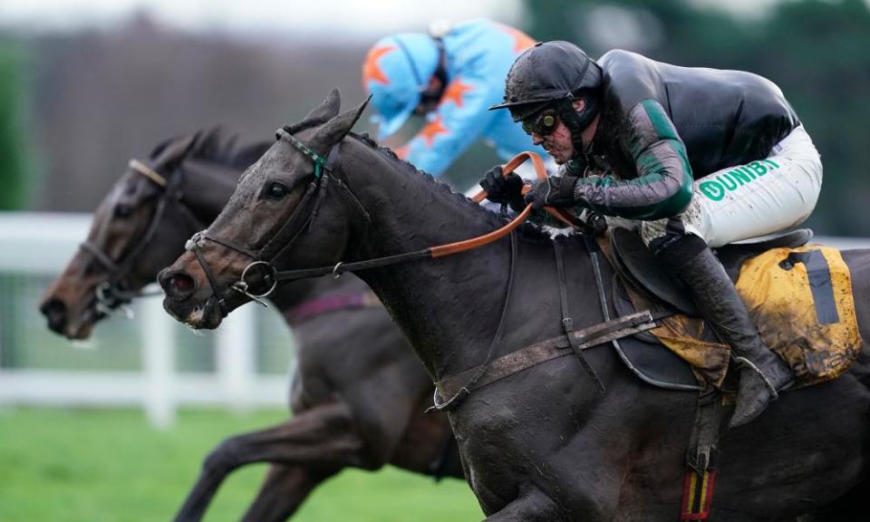 Altior, ridden by Nico de Boinville (foreground) takes on Un De Sceaux to win the Tingle Creek Chase at Sandown.