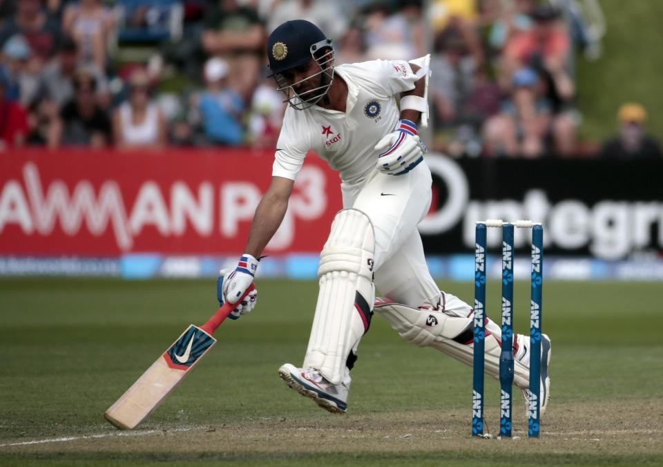 India's Ajinkya Rahane makes his ground against New Zealand during the first innings on day two of the second international test cricket match at the Basin Reserve in Wellington, February 15, 2014.