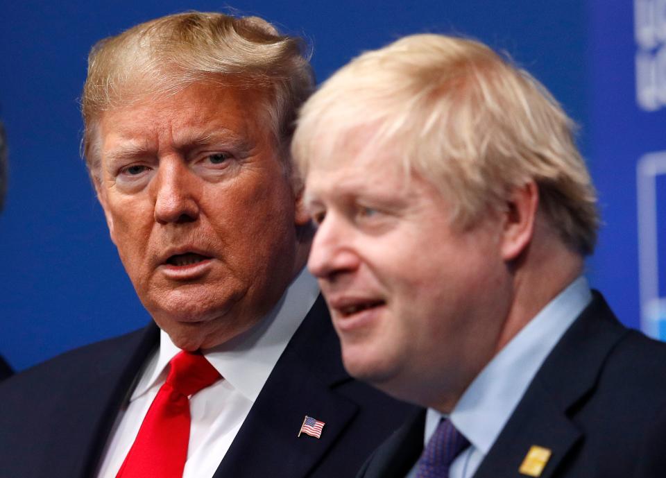 Britain's Prime Minister Boris Johnson (R) welcomes US President Donald Trump (L) to the NATO summit at the Grove hotel in Watford, northeast of London on December 4, 2019. (Photo by PETER NICHOLLS / various sources / AFP) (Photo by PETER NICHOLLS/AFP via Getty Images)