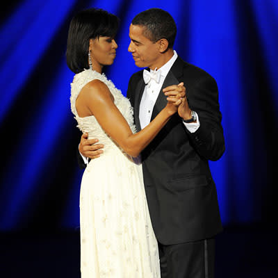 Michelle Obama wore winter white at the inaugural balls. (Getty)