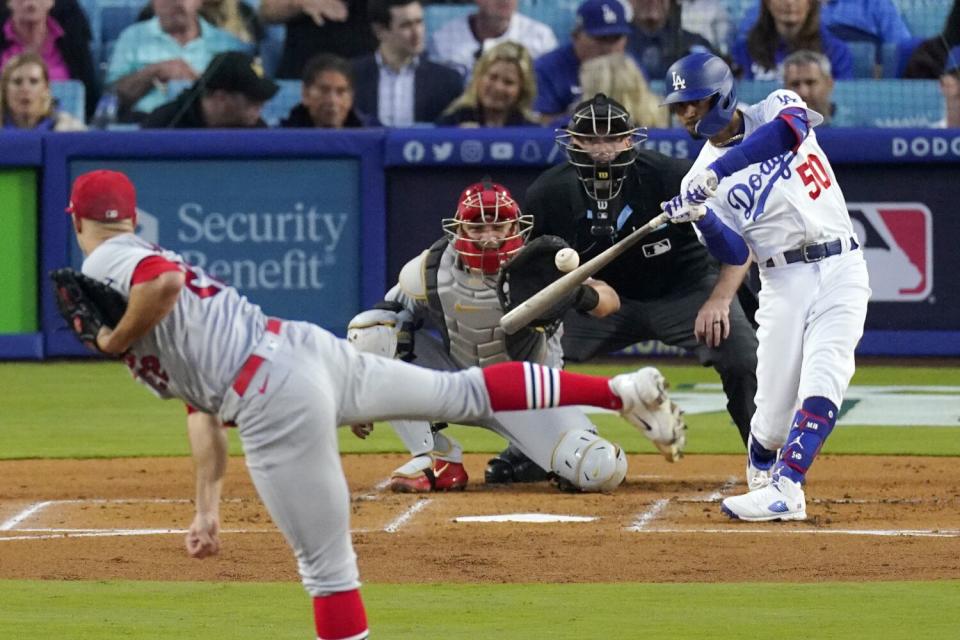 The Dodgers' Mookie Betts hits a solo home run off St. Louis Cardinals starting pitcher Jack Flaherty.