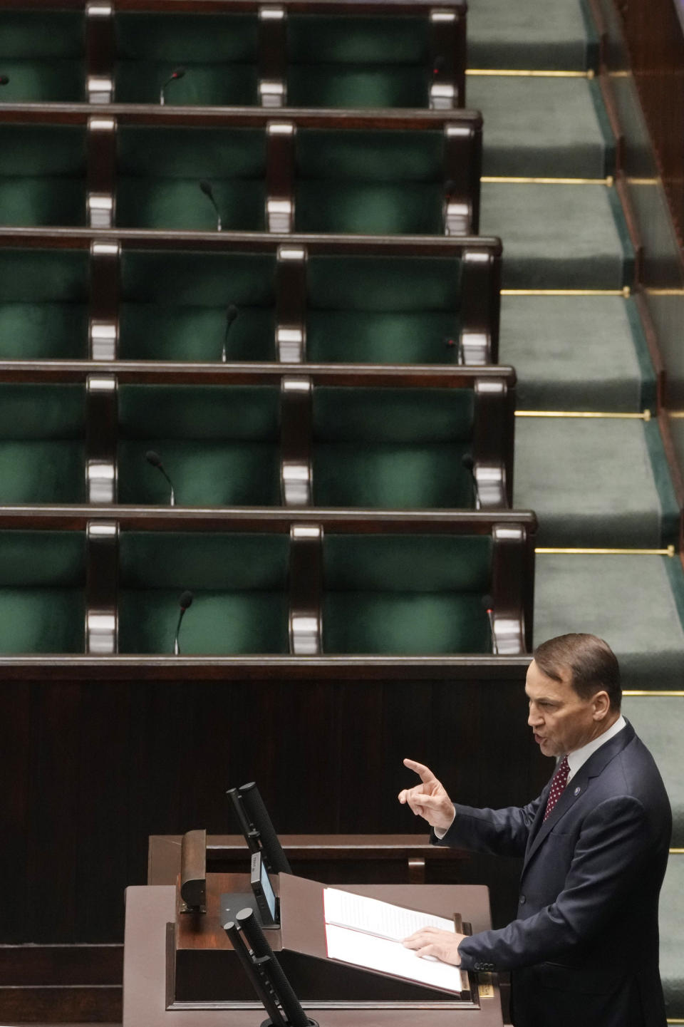 Poland's Foreign Minister Radek Sikorski delivers a speech to the parliament in Warsaw, Poland, on Thursday April 25, 2024. Sikorski told the parliament that the government wants to return to the group of countries which sets the agenda of the European Union, laying out the government's vision at a historically crucial moment with war across the border in Ukraine. (AP Photo/Czarek Sokolowski)