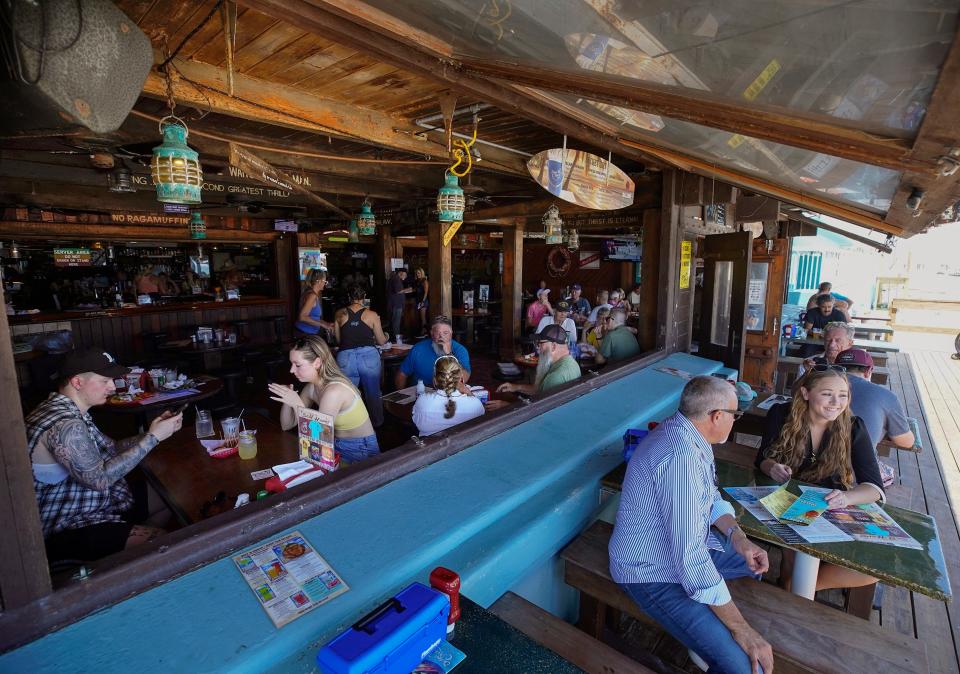 Lunchtime patrons soak up the atmosphere at the Ocean Deck & Beach Club, a Daytona Beach fixture since 1957.