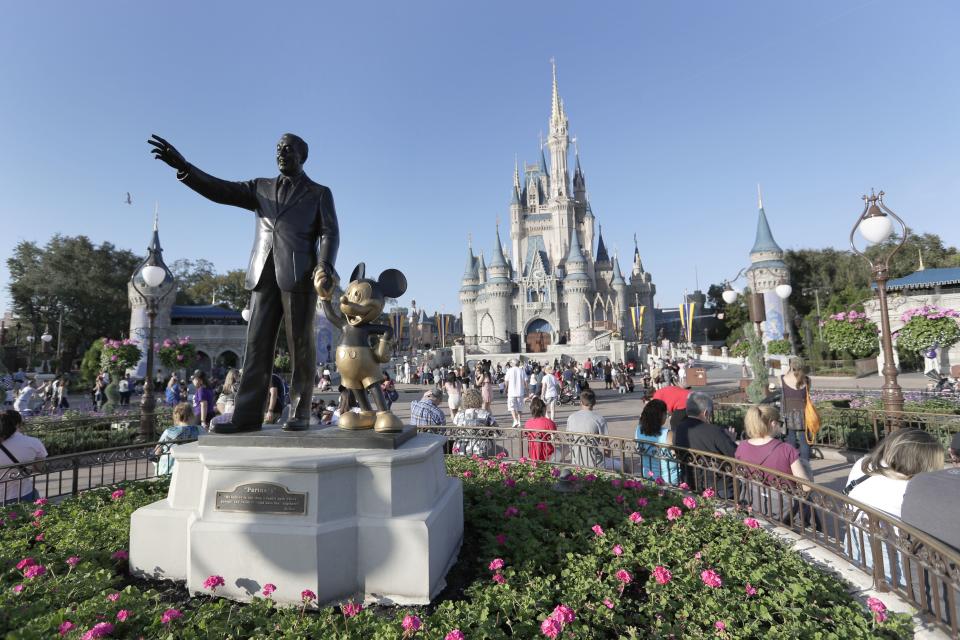 A statue of Walt Disney and Mickey Mouse appears in front of the Cinderella Castle at the Magic Kingdom theme park at Walt Disney World, Jan. 15, 2020, in Lake Buena Vista, Fla. The Utes will visit Central Florida for a Nov. 29 contest. | John Raoux, Associated Press