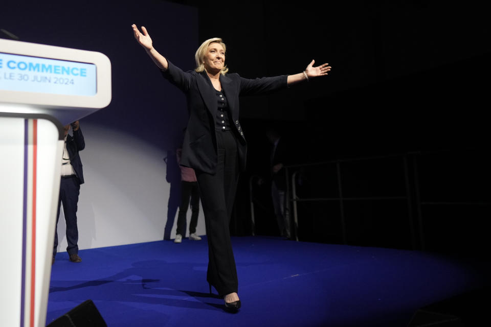 French far right leader Marine Le Pen gestures after delivering her speech after the release of projections based on the actual vote count in select constituencies , Sunday, June 30, 2024 in Henin-Beaumont, northern France. French voters propelled the far-right National Rally to a strong lead in first-round legislative elections Sunday and plunged the country into political uncertainty, according to polling projections. (AP Photo/Thibault Camus)