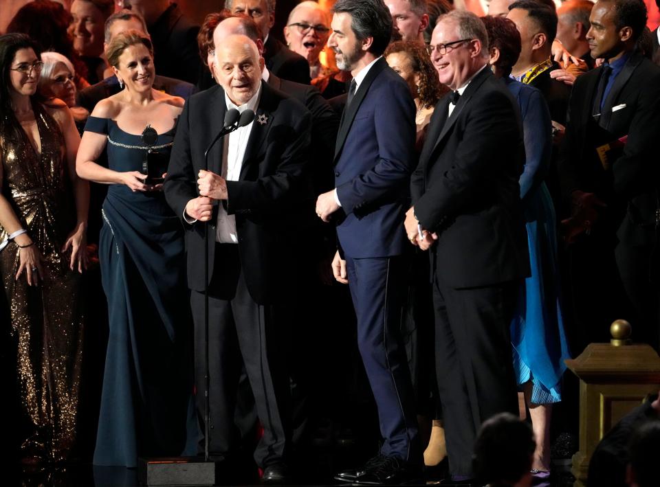 Alfred Uhry, center, and composer Jason Robert Brown to his right, accepting the award for best revival of a musical for “Parade” at the 2023 Tony Awards.