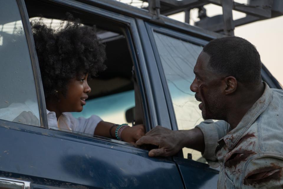 Leah Sava Jeffries and Idris Elba in "Beast."