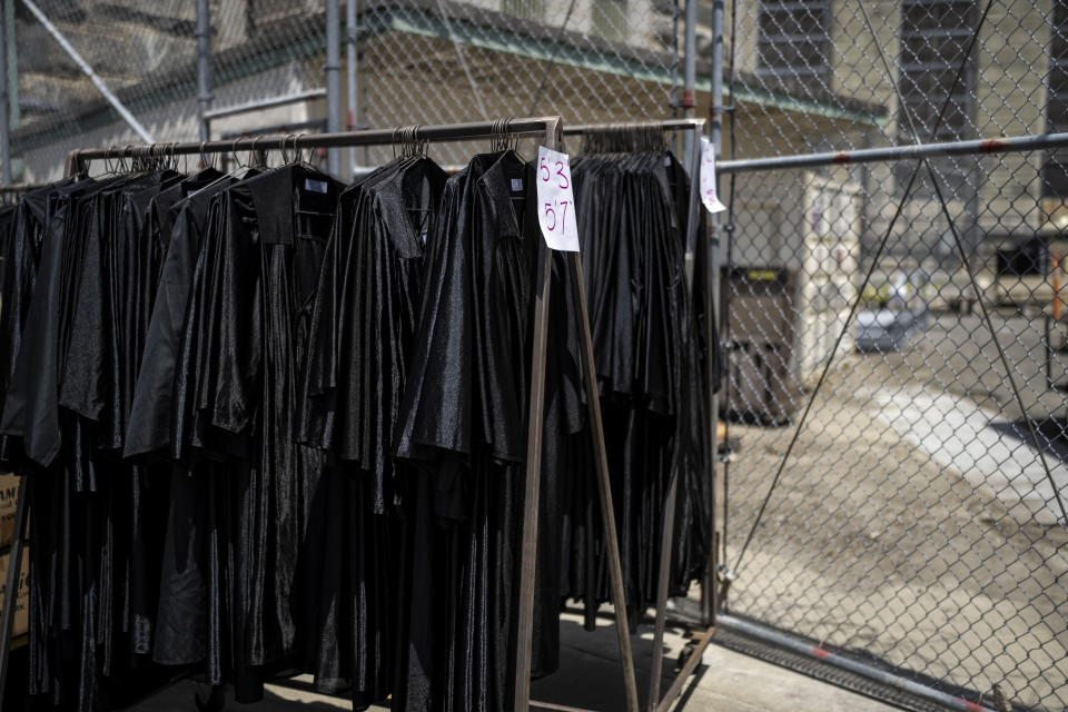 Graduation gowns hang in racks after a ceremony at Folsom State Prison in Folsom, Calif., Thursday, May 25, 2023. Studies have shown that taking any kind of courses while behind bars results in a 43% less likelihood that a former prisoner will commit more crime and return to prison. (AP Photo/Jae C. Hong)
