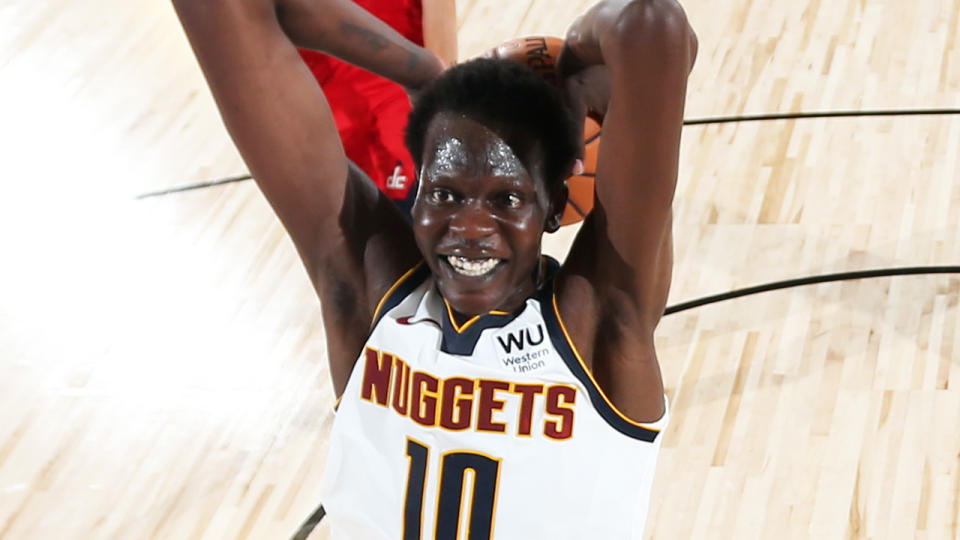 Denver Nuggets rookie Bol Bol is pictured rising up for a slam dunk against the Washington Wizards.