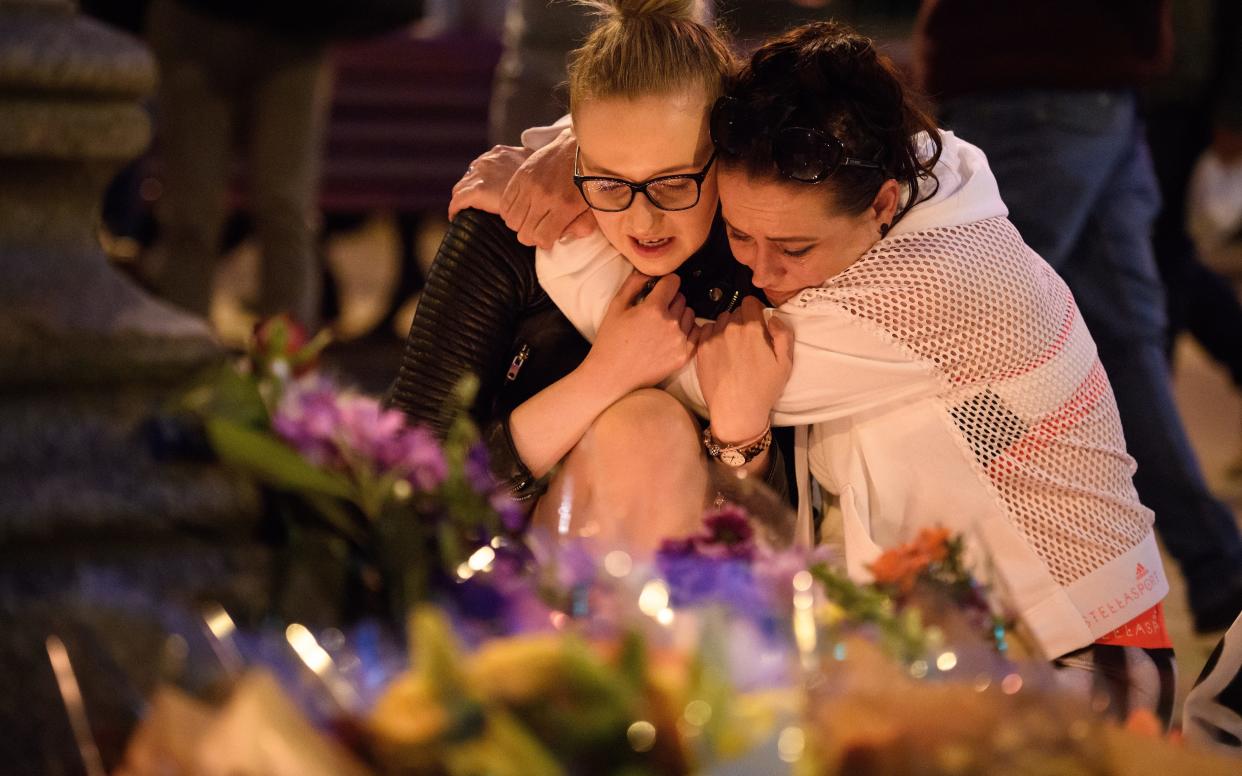 Women console each other at Manchester vigil for the victims of the attack - 2017 Getty Images