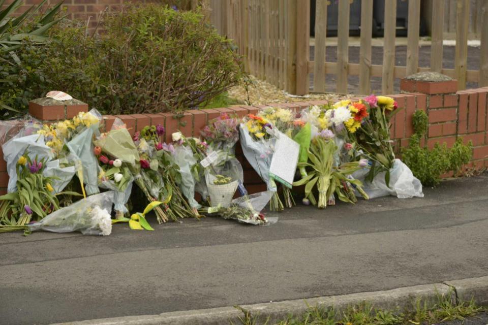 Wiltshire Times: Floral tributes have been laid at Drynham Road to the chair of Avon Valley Runners Sara Robert who died suddenly. Image: Trevor Porter 76931-1