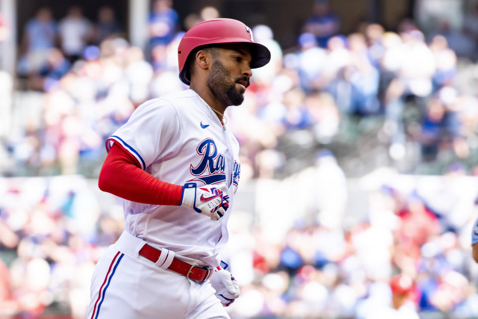 Texas Rangers' Marcus Semien (2) runs the bases after hitting a solo home run against the Philadelphia Phillies during a baseball game in Arlington, Texas, Saturday, April 1, 2023. (AP Photo/Emil T. Lippe)