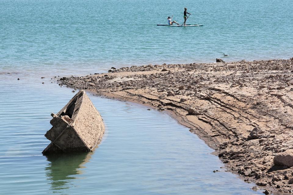 LAKE MEAD NATIONAL RECREATION AREA, NEVADA - JULY 01: A sunken World War II-Era Higgins landing craft that used to be nearly 200 feet underwater is being revealed near the Lake Mead Marina as the waterline continues to lower on July 01, 2022 in the Lake Mead National Recreation Area, Nevada. The water level at Lake Mead is at its lowest since being filled in 1937 after the construction of the Hoover Dam as a result of a climate change-fueled megadrought coupled with increased water demands in the Southwestern United States. (Photo by Ethan Miller/Getty Images)