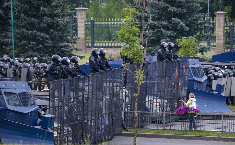 FILE In this Sunday, Aug. 23, 2020 file photo, a woman gestures in front of a riot police blockade during a protest in Minsk, Belarus. President Alexander Lukashenko earned the nickname of “Europe’s last dictator” in the West for his relentless repression of dissent since taking the helm in 1994. was once called “Europe’s last dictator” in the West and has ruled Belarus with an iron fist for 27 years. But when massive protests that began last August presented him with an unprecedented challenge, he responded with exceptional force. (AP Photo, File)